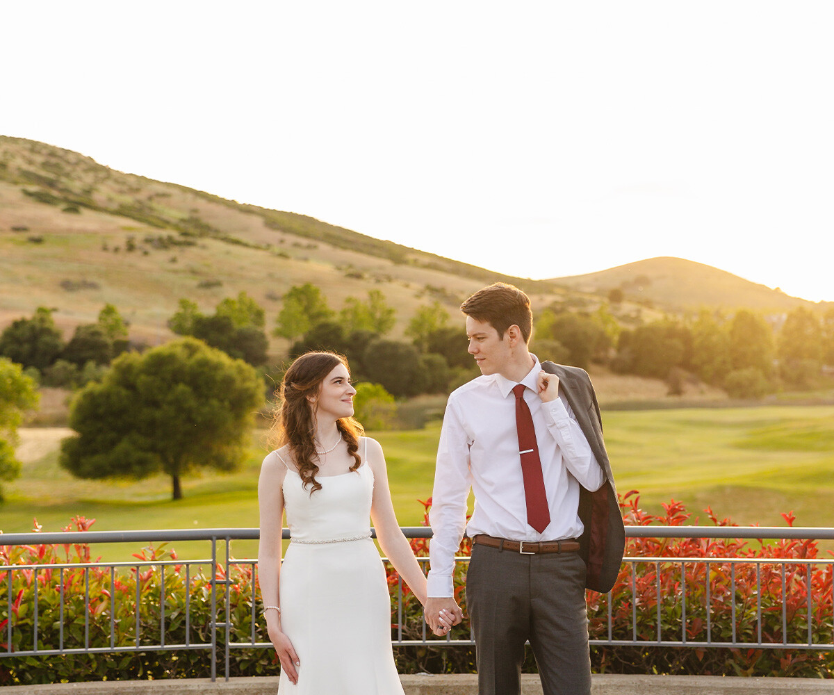 Couple in front of beautiful views - Hiddenbrooke Hills by Wedgewood Weddings