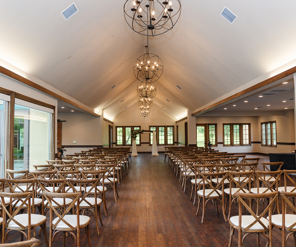 Indoor ceremony with floral at Hiddenbrooke Hills by Wedgewood Weddings