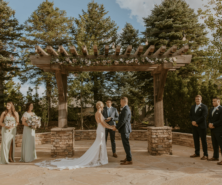 An outdoor ceremony at Ken Caryl Vista by Wedgewood Weddings 