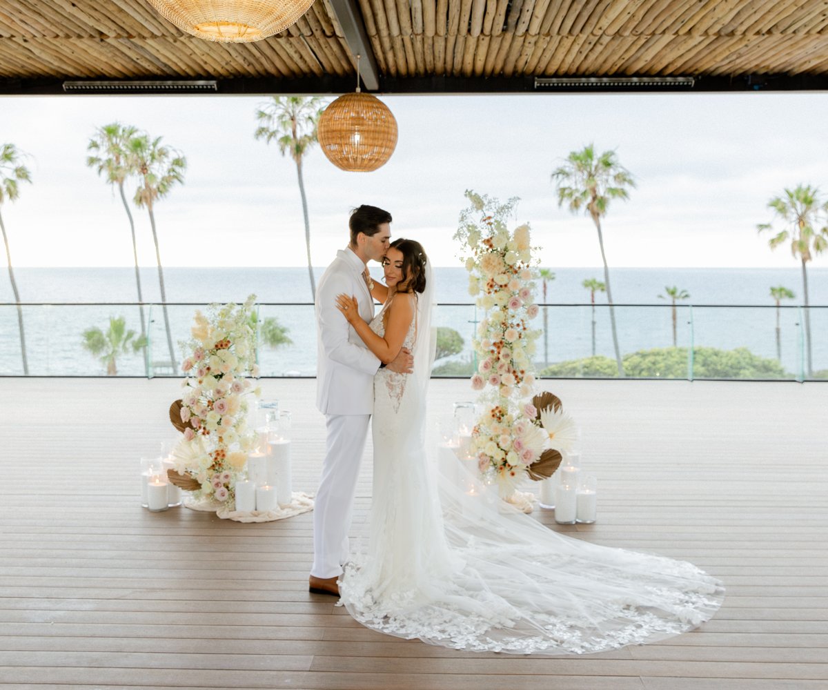 Bride-and-Groom-enjoy-a-sweet-moment-after-ceremony-at-La-Jolla-Cove-Rooftop
