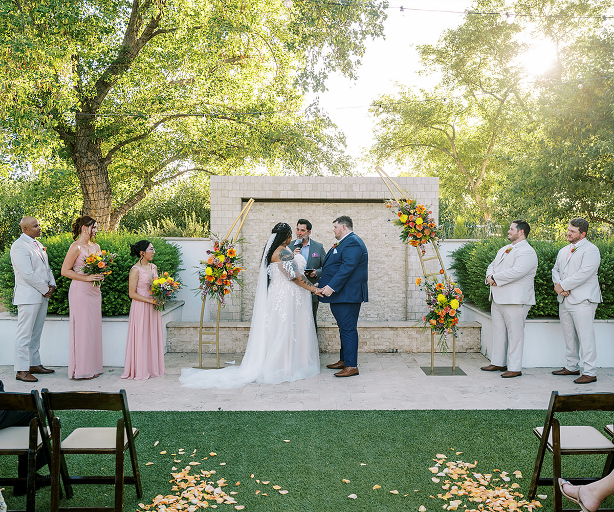 Ceremony with bright florals at Lindsay Grove by Wedgewood Weddings