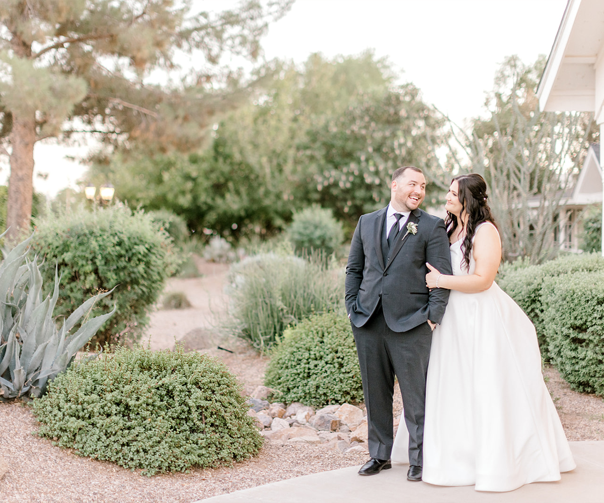 Couple among greenery at Lindsay Grove by Wedgewood Weddings