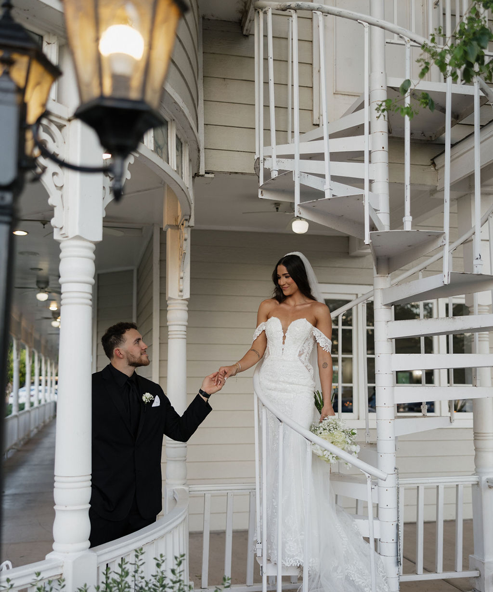 Couple on spiral staircase - Lindsay Grove by Wedgewood Weddings