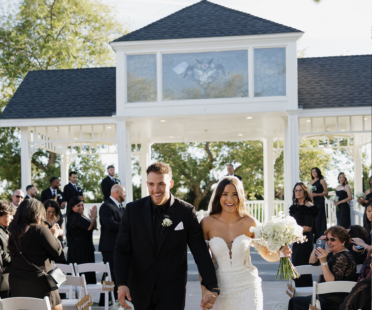 Newlyweds walking down the aisle - Lindsay Grove by Wedgewood Weddings