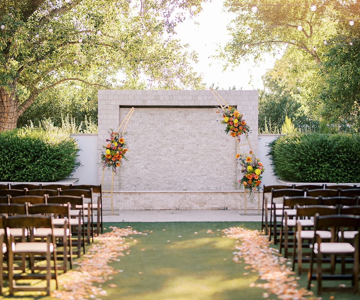 Waterfall ceremony site with gold arch - Lindsay Grove by Wedgewood Weddings