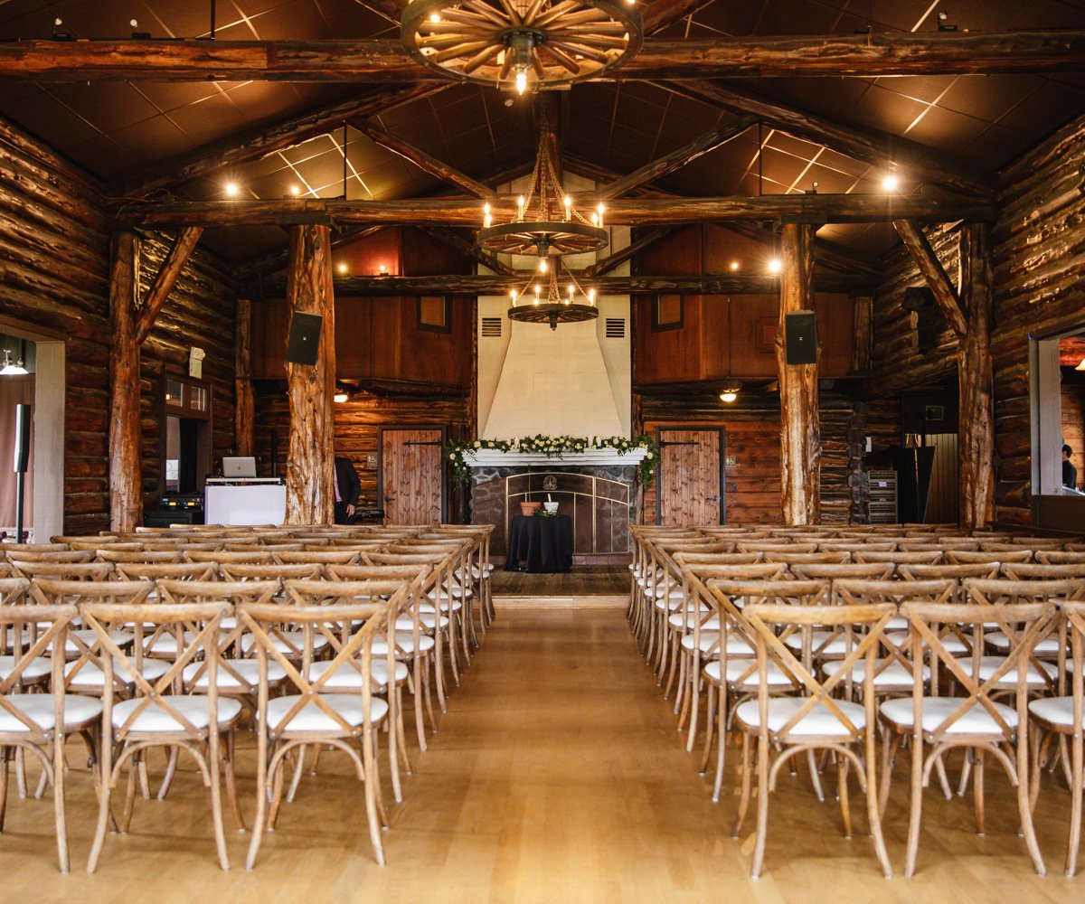 Indoor wedding ceremony in front of the fire place - Log Cabin at the Presidio - Wedgewood Weddings