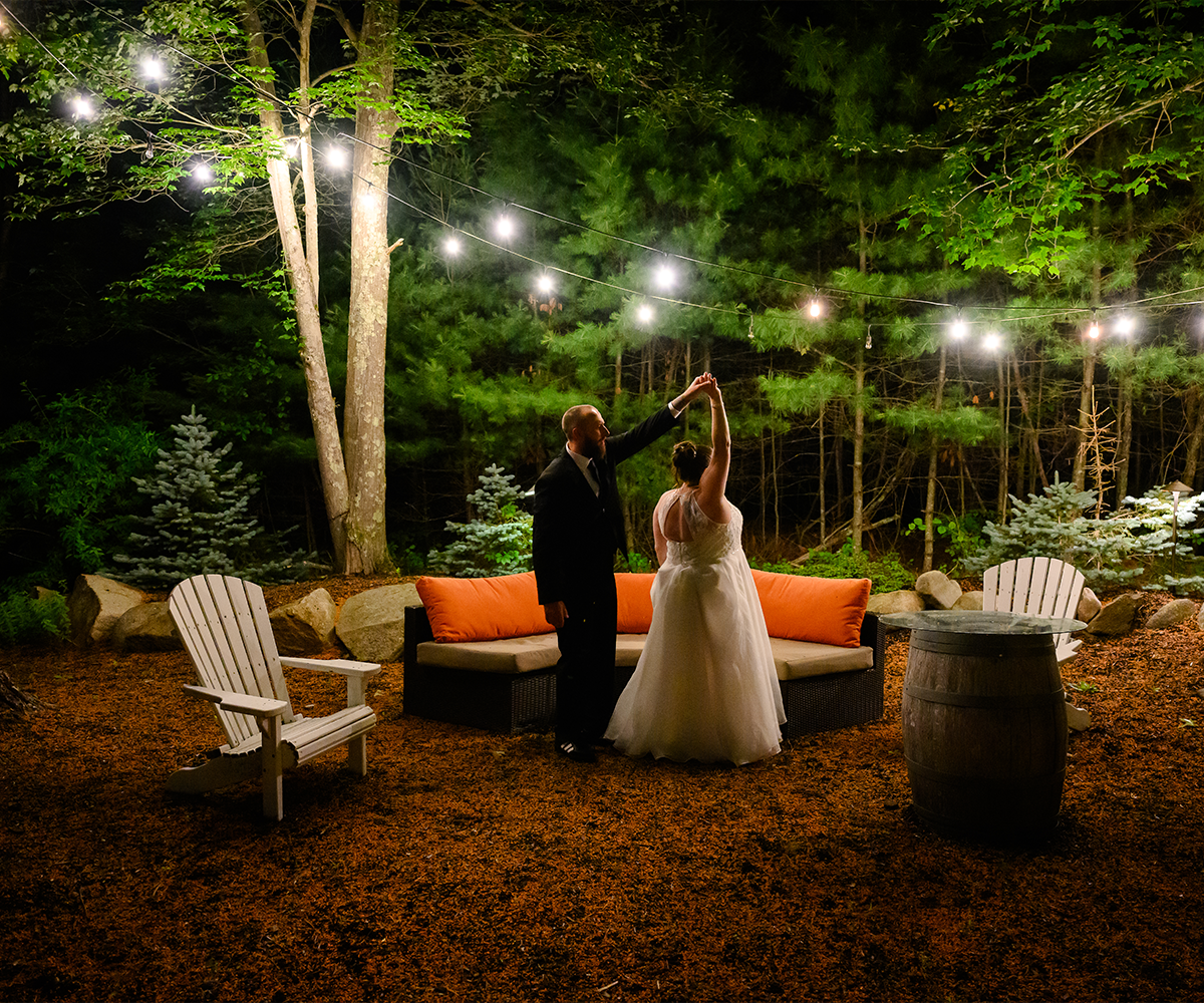 Couple dancing at nighttime at Miraval Gardens by Wedgewood Weddings