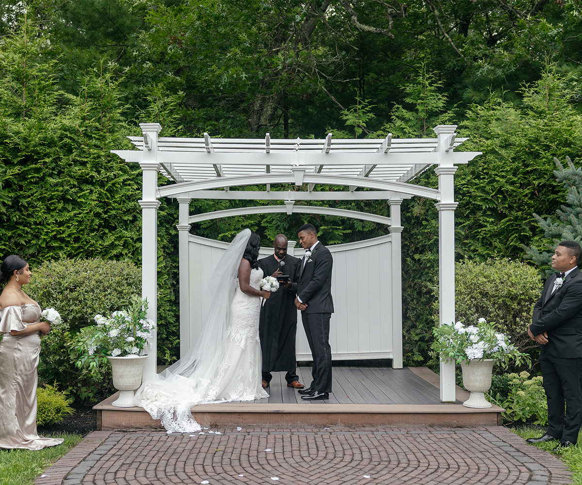 Couple during the ceremony - Miraval Gardens by Wedgewood Weddings