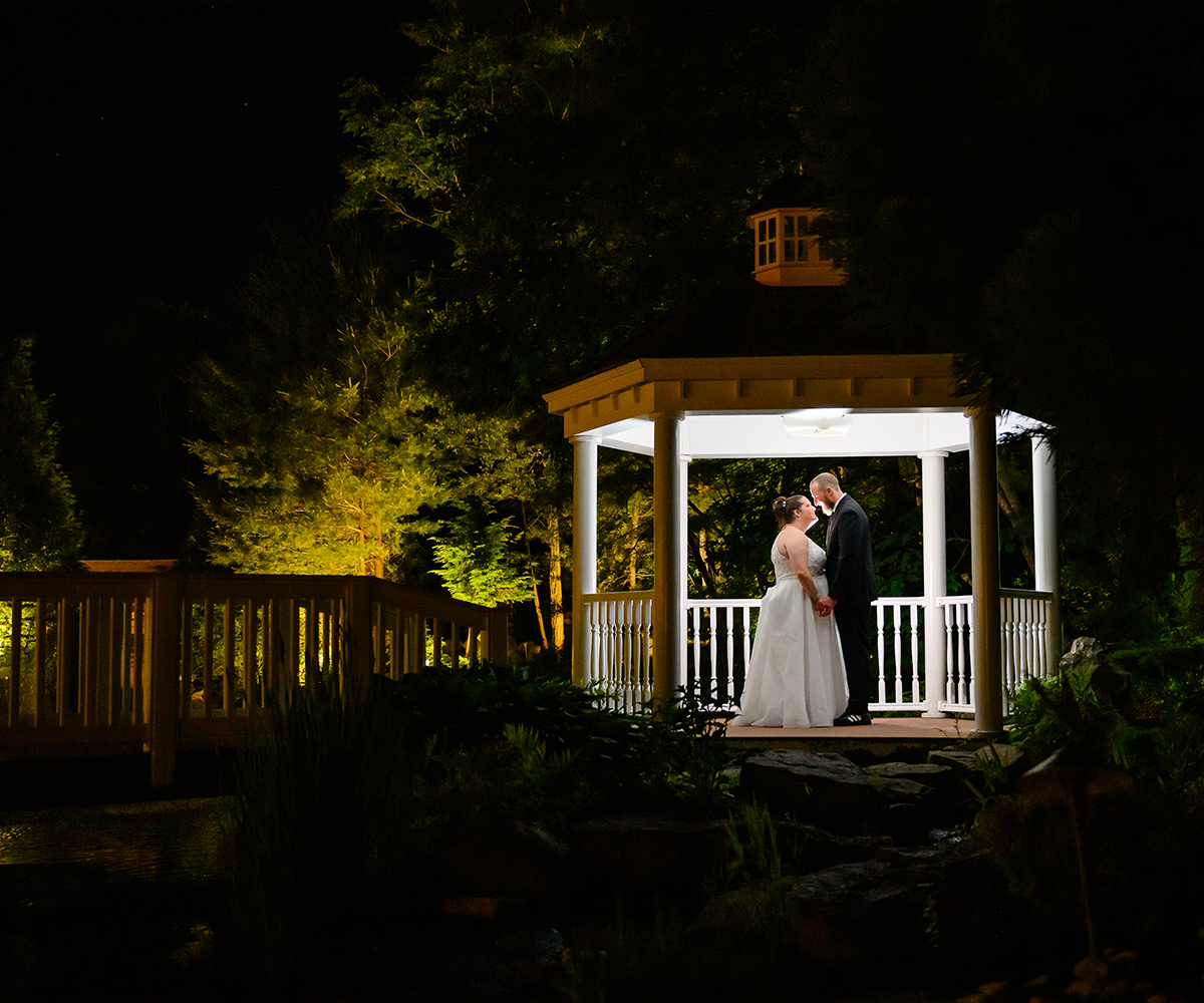 Couple in pergola at night - Miraval Gardens by Wedgewood Weddings