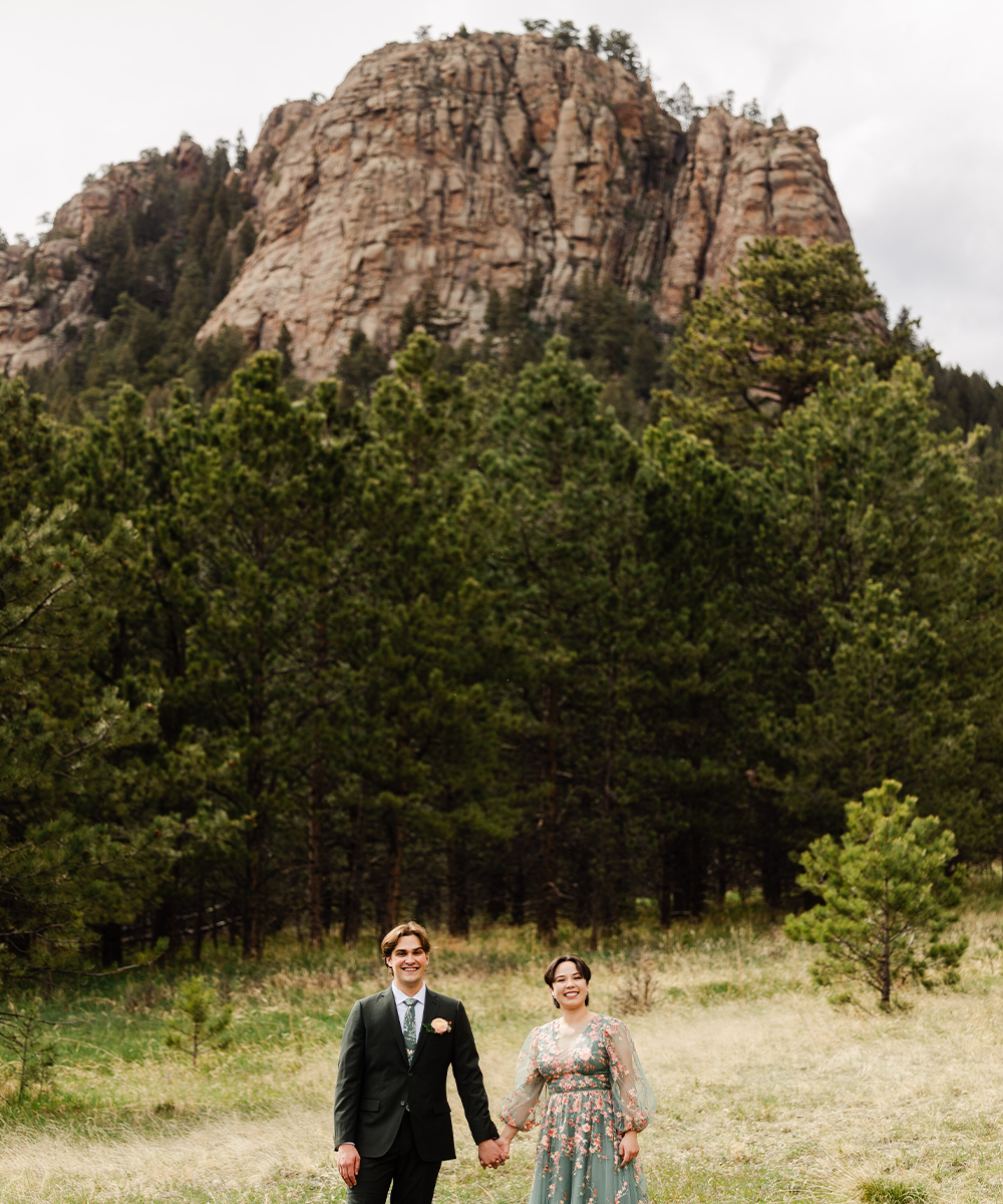 Newlyweds in front of mountain - Lake View at Mountain View Ranch