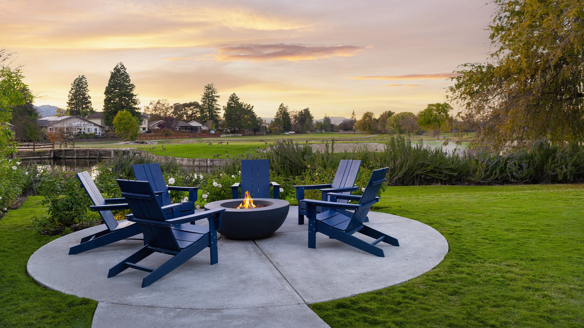 Lakeside Fire Pit and Lounge Area with Mountain Views and Weeping Willow Trees