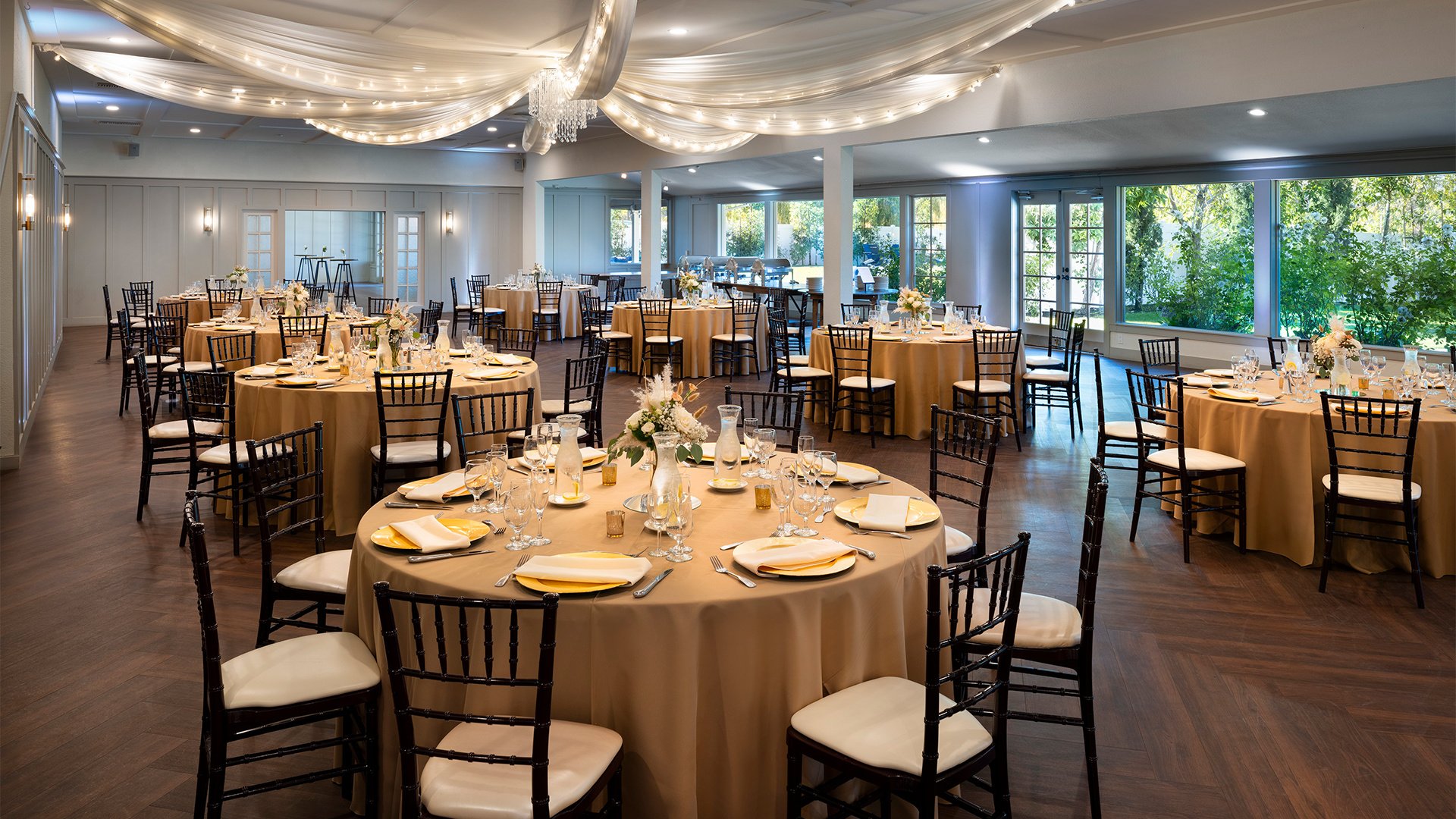 Wedding Reception Ballroom with Champagne Linens and Crystal-Accented Ceiling Design