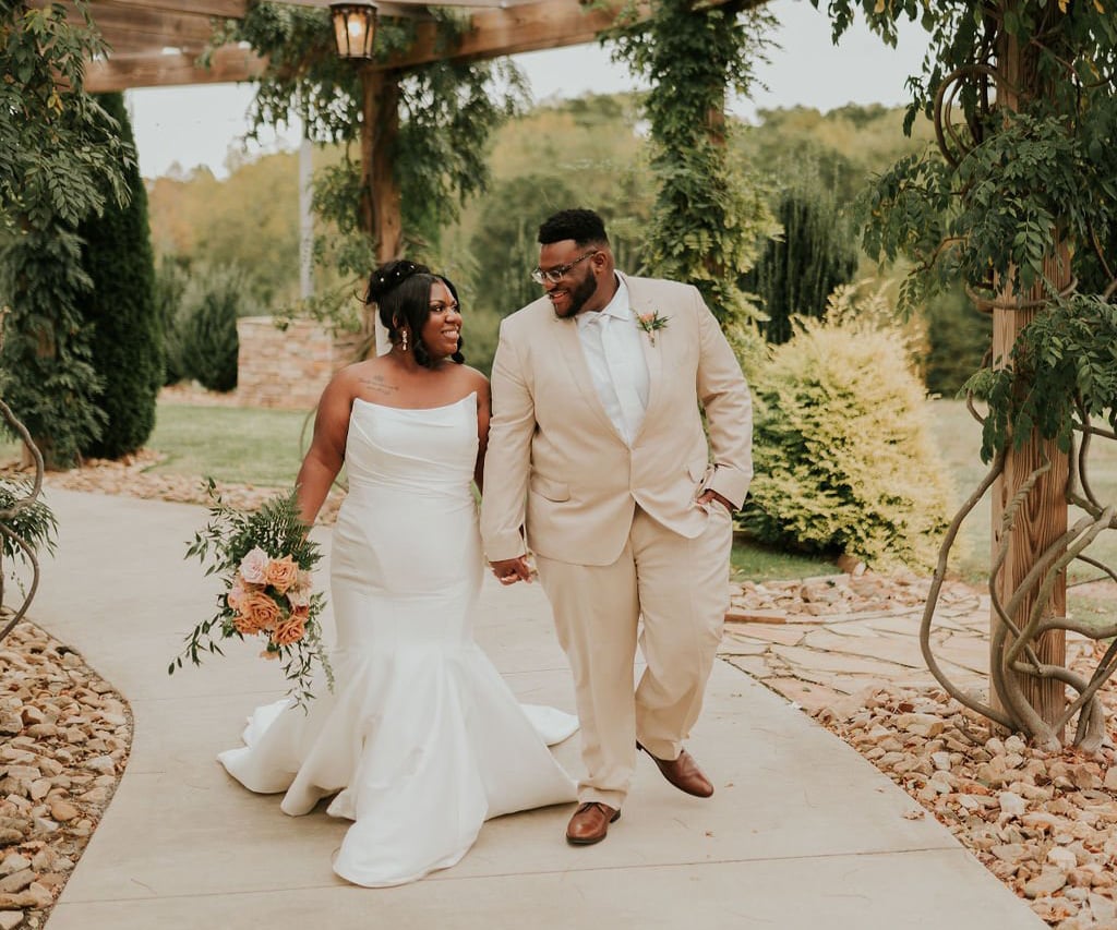 Couple strolling through beautiful grounds at Spinning Leaf by Wedgewood Weddings-1