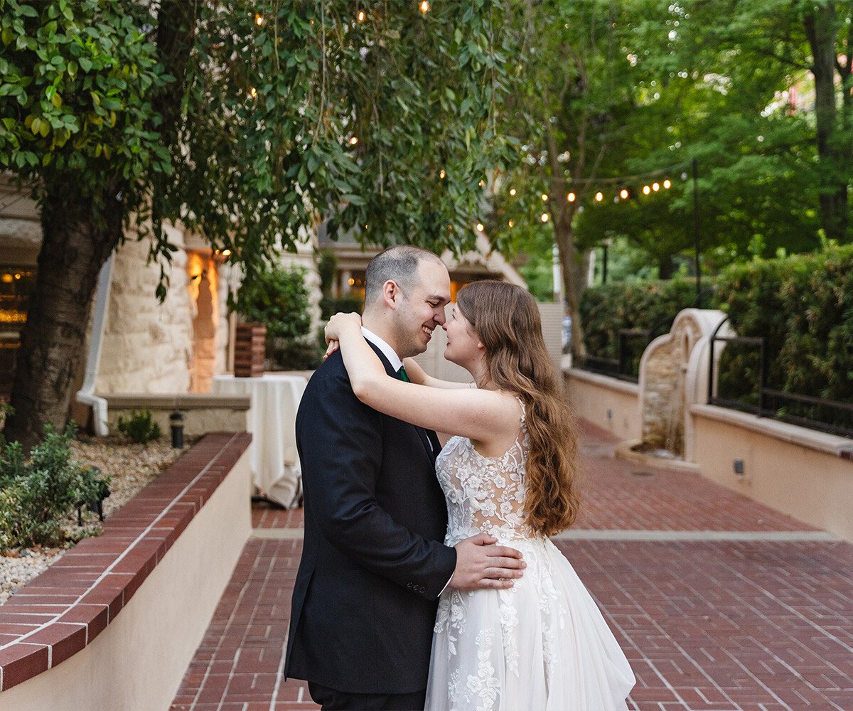 Couple embracing on patio - Sterling Hotel by Wedgewood Weddings