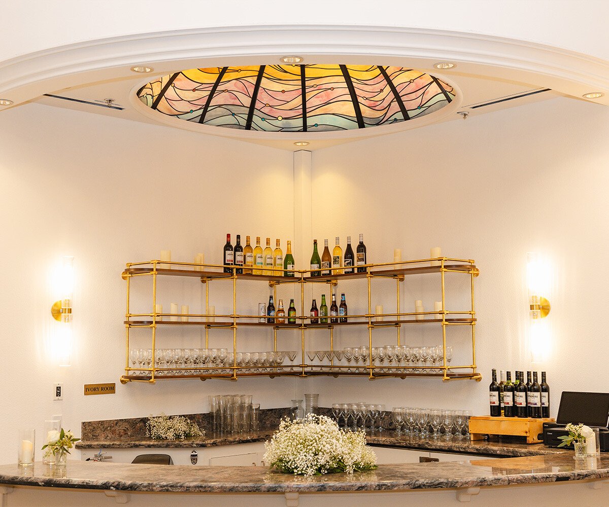 Gold upscale bar area with stained glass window - Sterling Hotel by Wedgewood Weddings