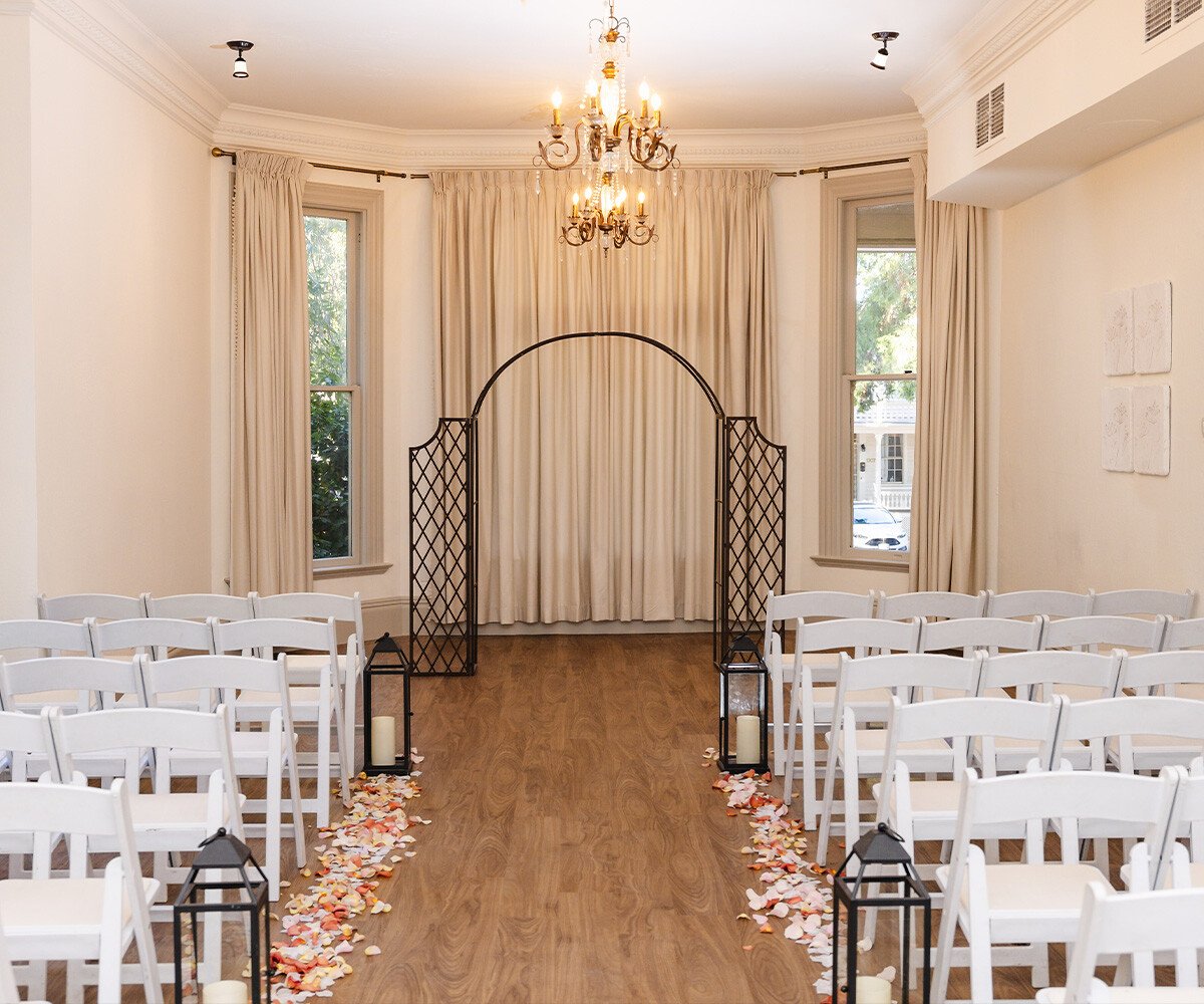 Indoor ceremony site with draping and chandeliers - Sterling Hotel by Wedgewood Weddings