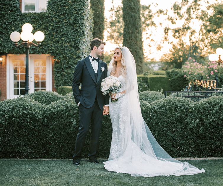 Couple with lots of greenery at Stonebridge Manor