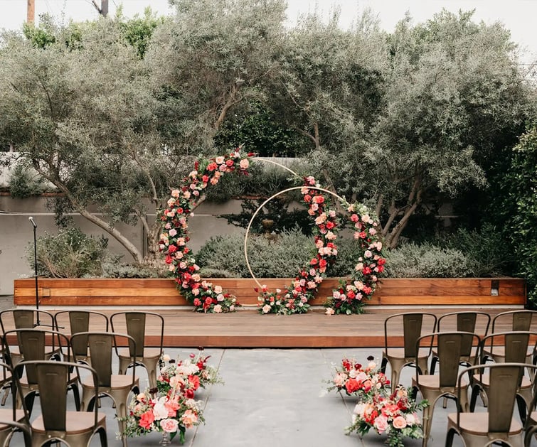 Ceremony with arch and dramatic flowers - The Harper by Wedgewood Weddings