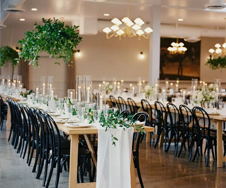 Grand hall with long tables and greenery - The Harper by Wedgewood Weddings