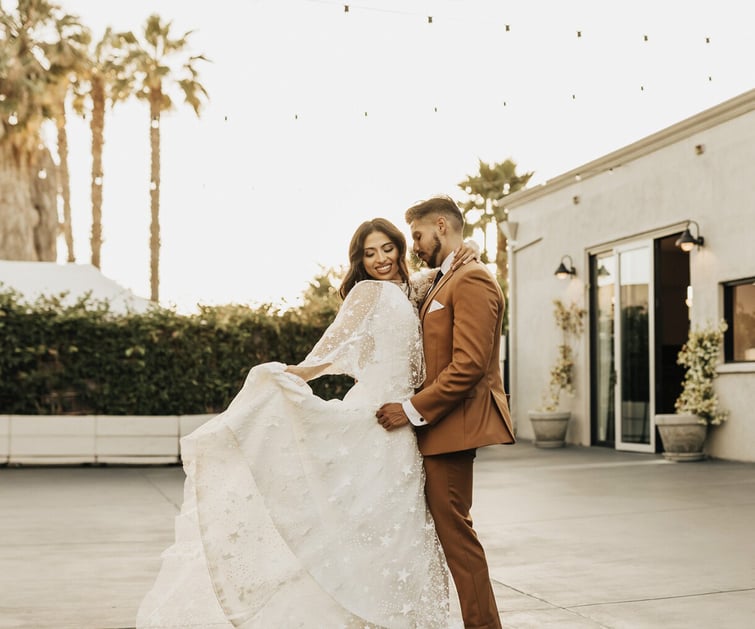 Golden hour portraits at The Harper featuring modern architecture, market lights, and California palm trees