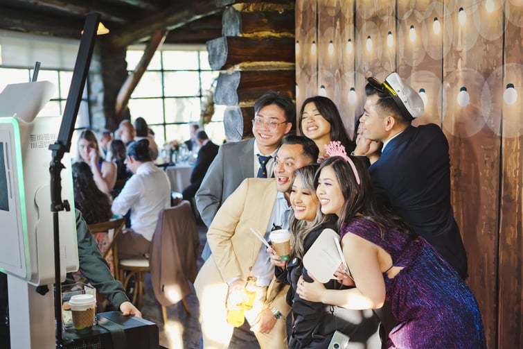 Guests having fun in the Wedgewood Weddings Photobooth