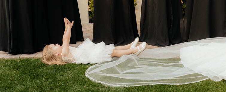 Cute flower girl laying down during the ceremony-1