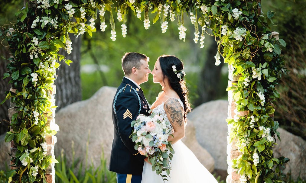 Bride & Groom Under Floral Arch at Boulder Creek by Wedgewood Weddings