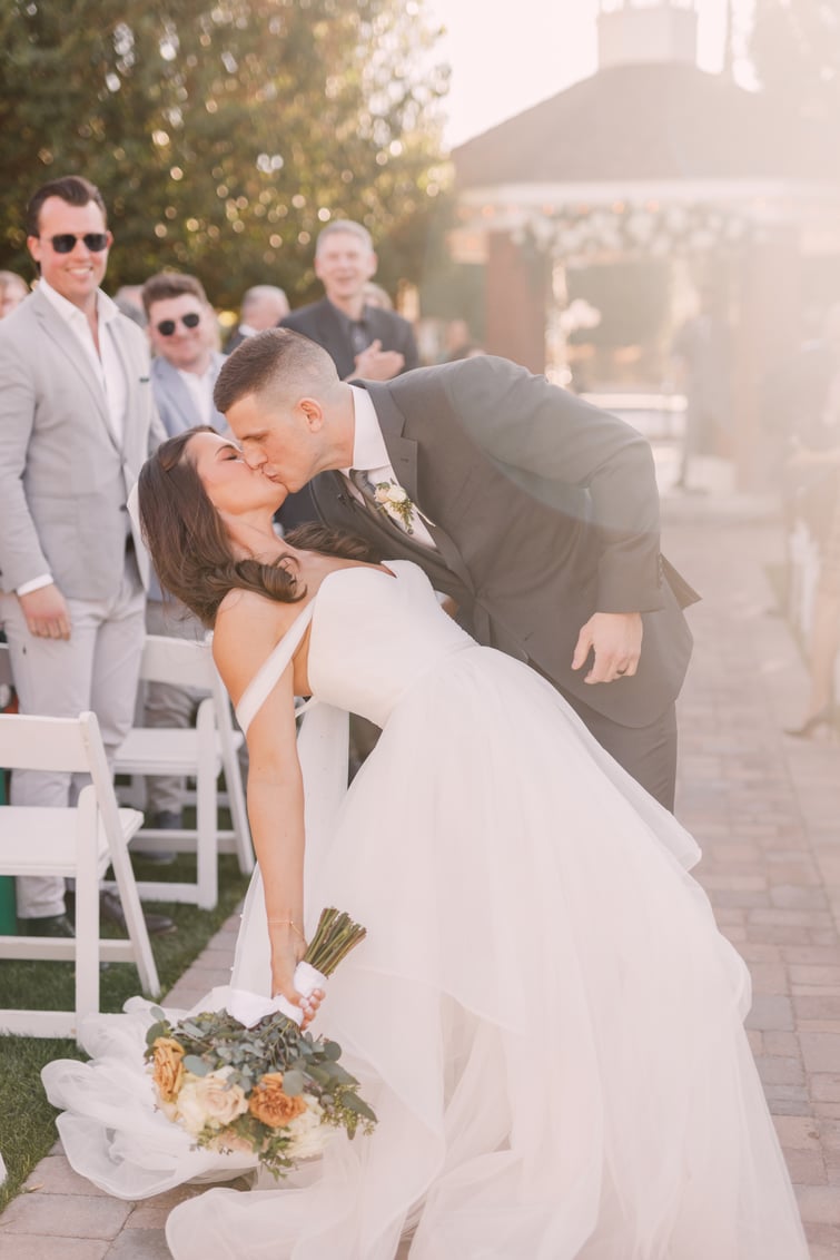 Mitch and Raelyn's kiss at the end of the aisle