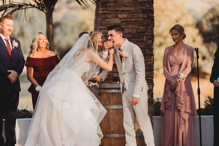 Maria and Hayden enjoying a bite of their "holy guacamole" for the first time after making it on the altar