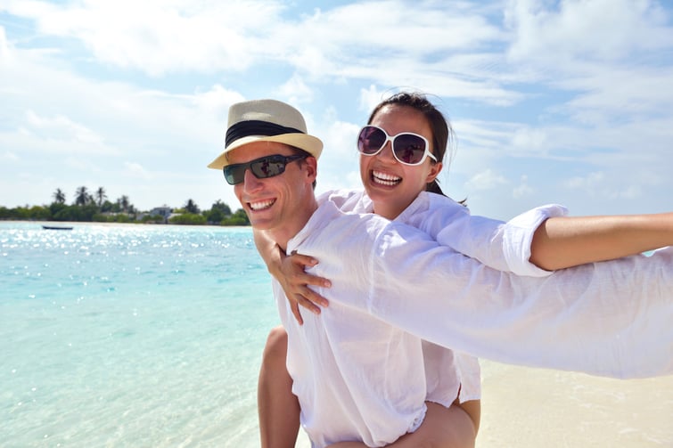 happy young romantic couple in love have fun running and relaxing on beautiful beach