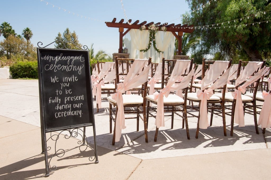 outdoor wedding chair decor pink sash chalkboard sign