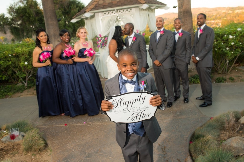 ring bearer holding wedding sign