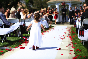 flower girl walking down aisle