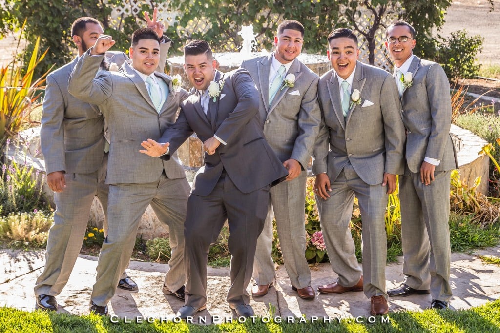 groom and groomsmen posing together